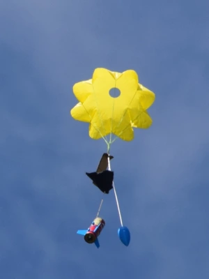 A rocket made from a Pringle's can descends under parachute